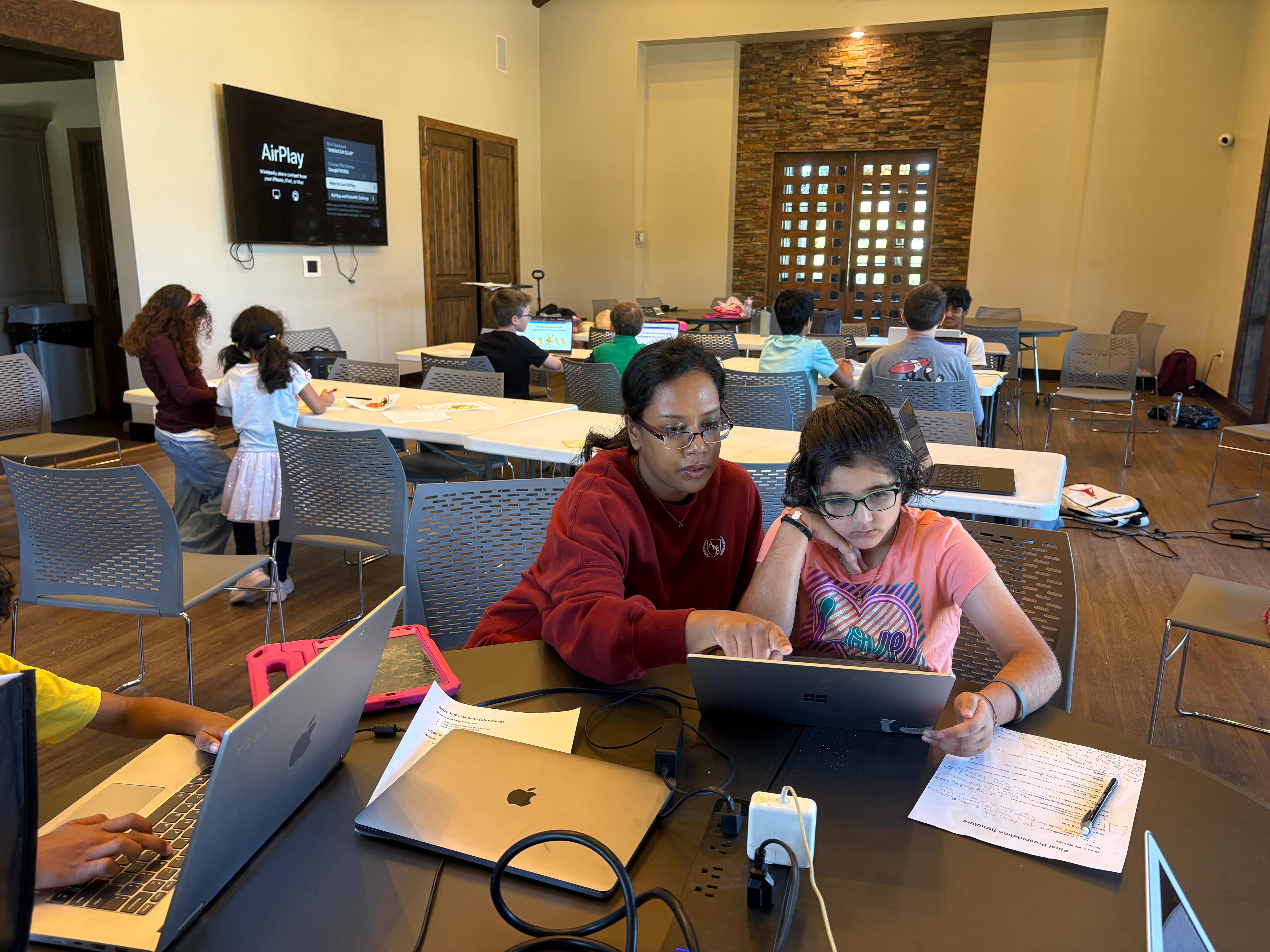 Students building projects at camp
